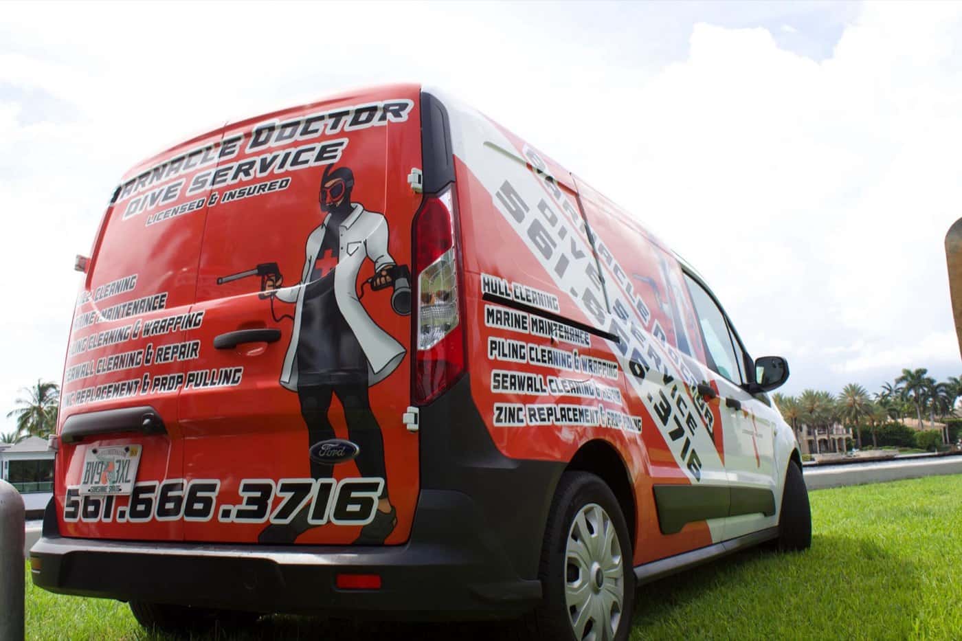 Barnacle Doctor service van with the 561-666-3716 phone number on its side