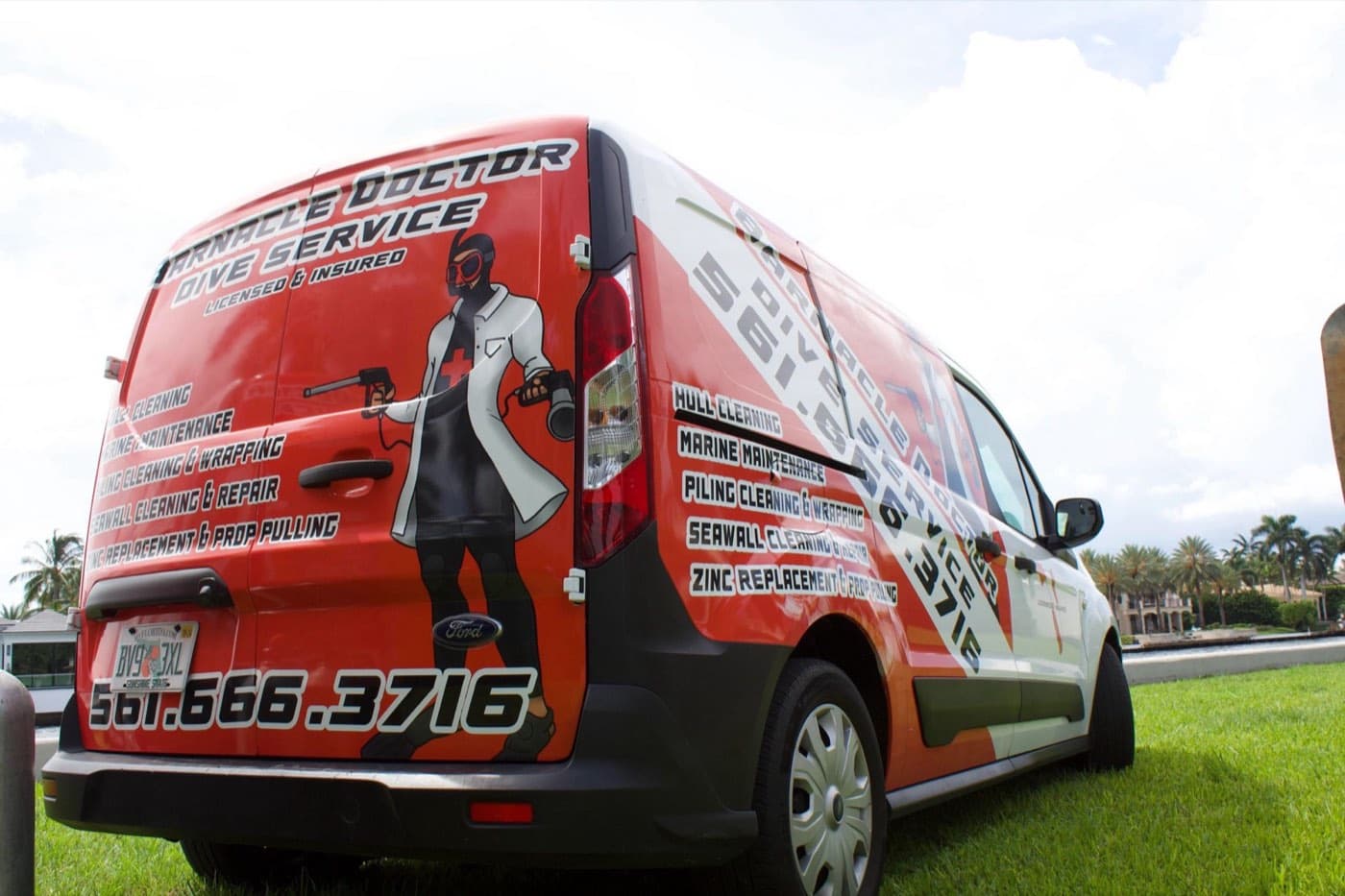 Barnacle Doctor service van with the 561-666-3716 phone number on its side